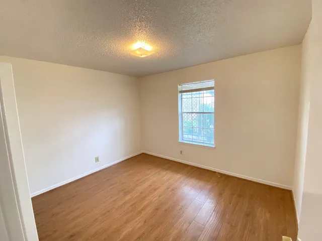a view of a hallway with wooden shelves