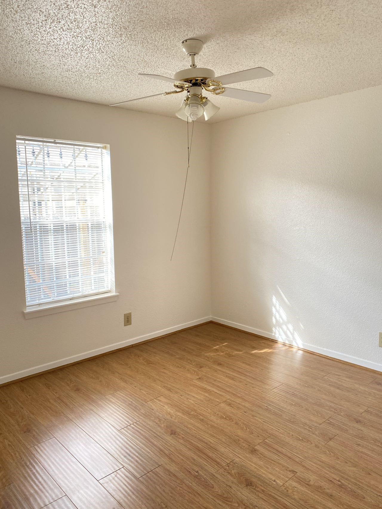 6201 Ranchester Drive, Unit 19 Houston, TX 77036 - Photo 19 of 26 wooden floor in an empty room with a window