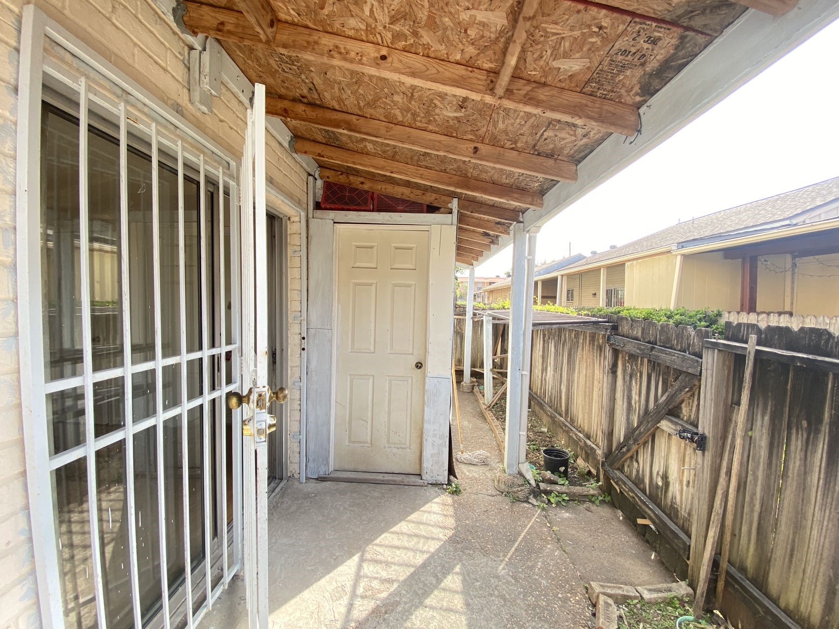 6201 Ranchester Drive, Unit 19 Houston, TX 77036 - Photo 22 of 26 a view of a porch with wooden floor and fence