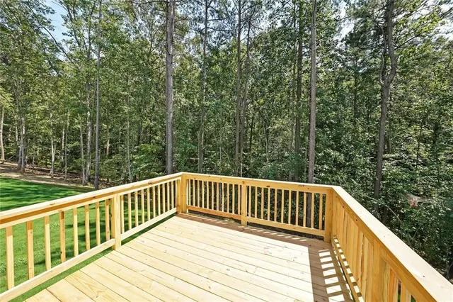 a view of balcony with deck and wooden floor