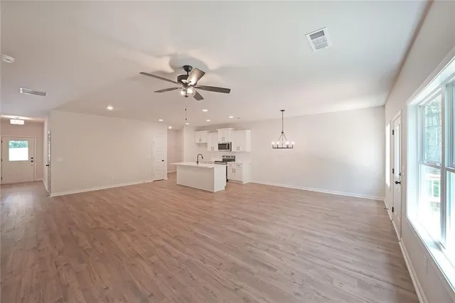 a view of an empty room with a window