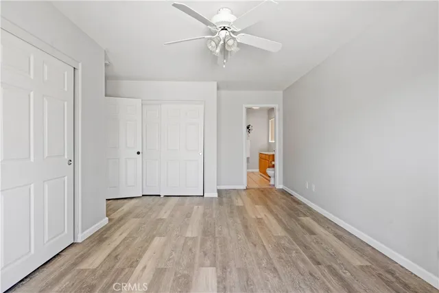a view of an empty room and wooden floor