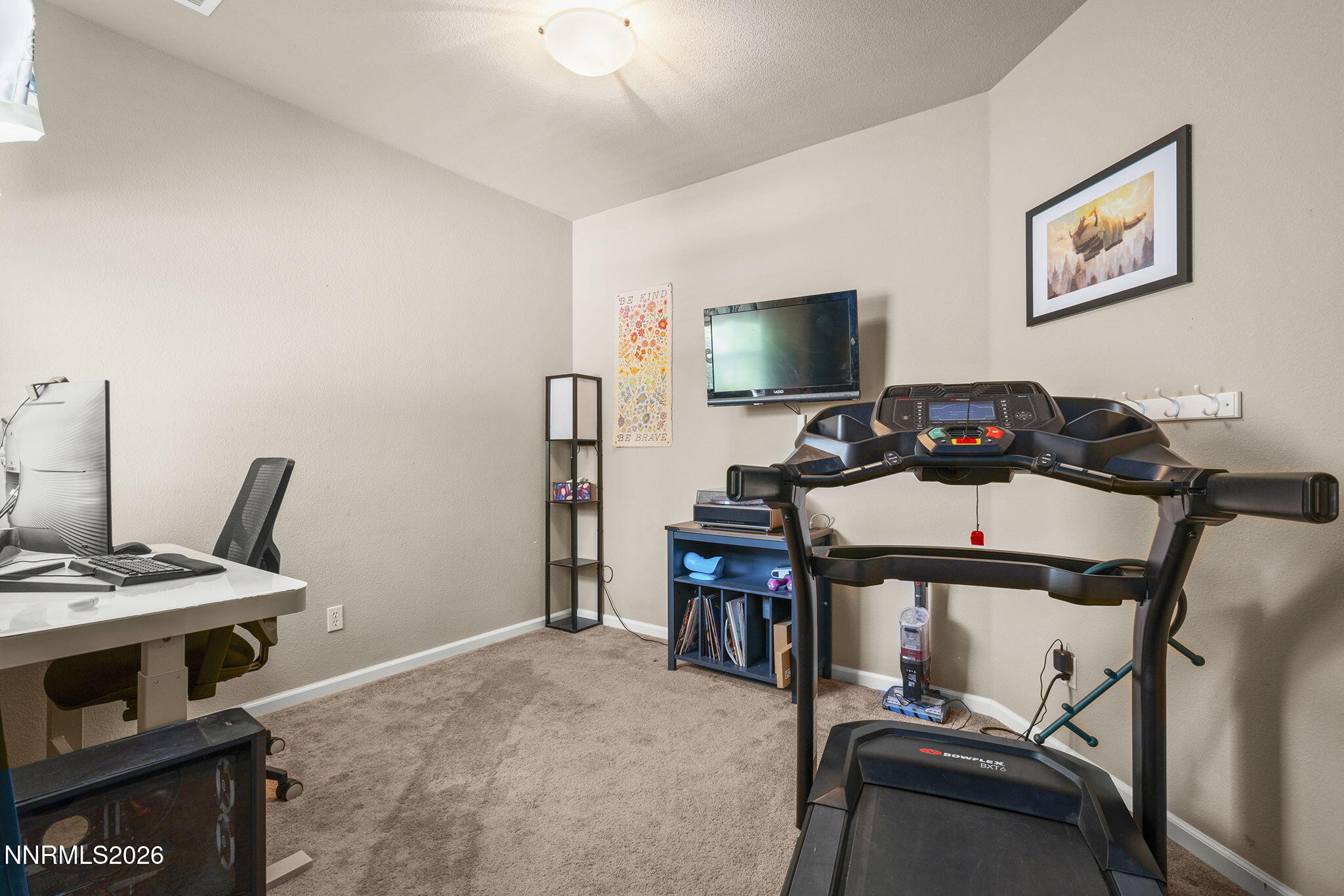11041 Colton Drive Reno, NV 89521 - Photo 16 of 28 a view of a workspace with furniture and a flat screen tv