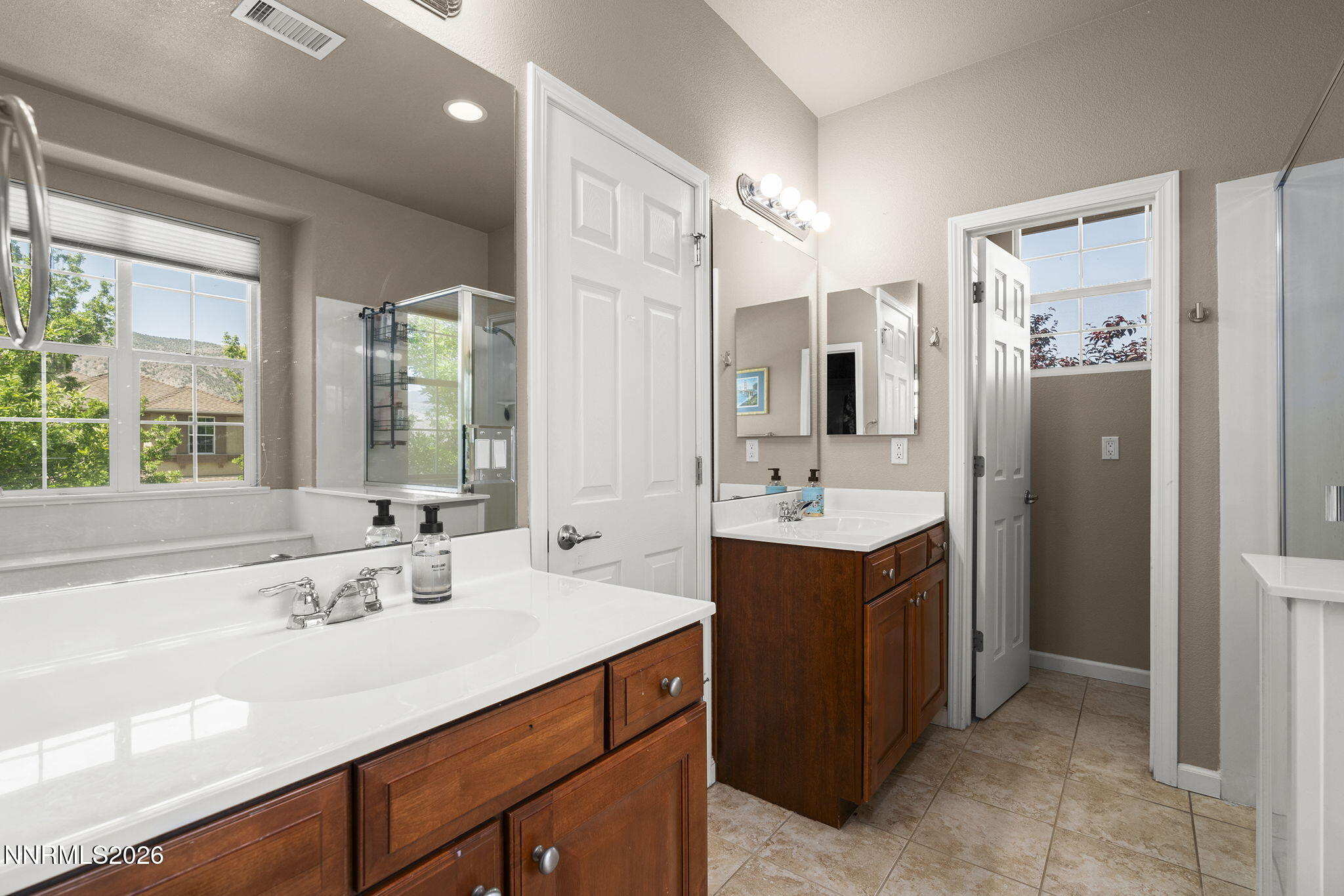 11041 Colton Drive Reno, NV 89521 - Photo 17 of 28 a bathroom with a sink double vanity and a mirror