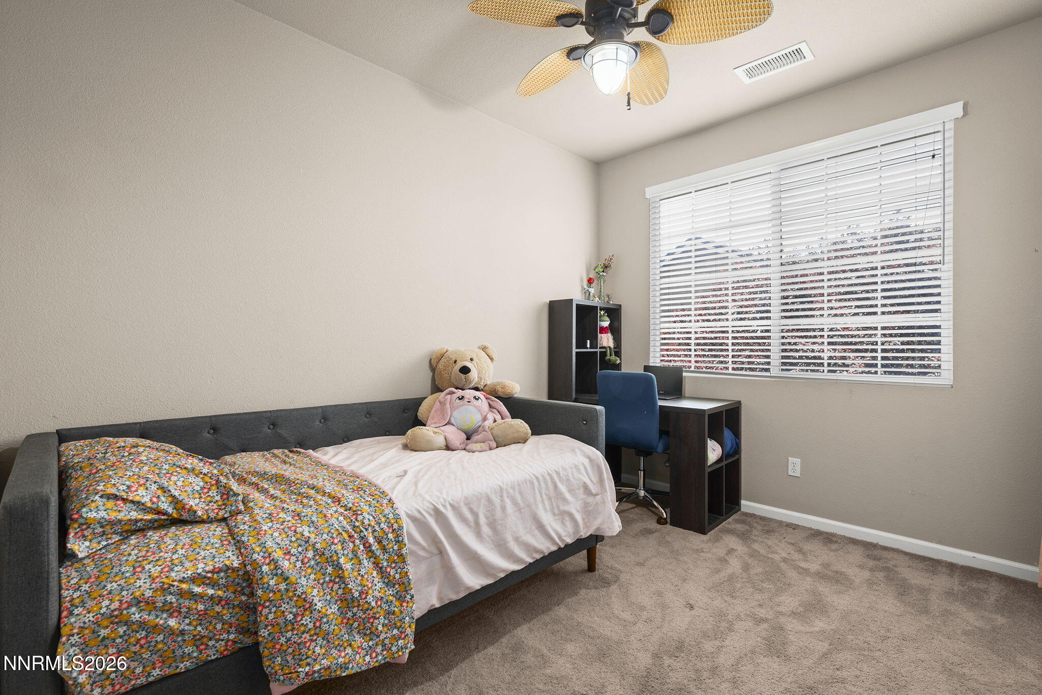 11041 Colton Drive Reno, NV 89521 - Photo 19 of 28 a bedroom with a bed and a window