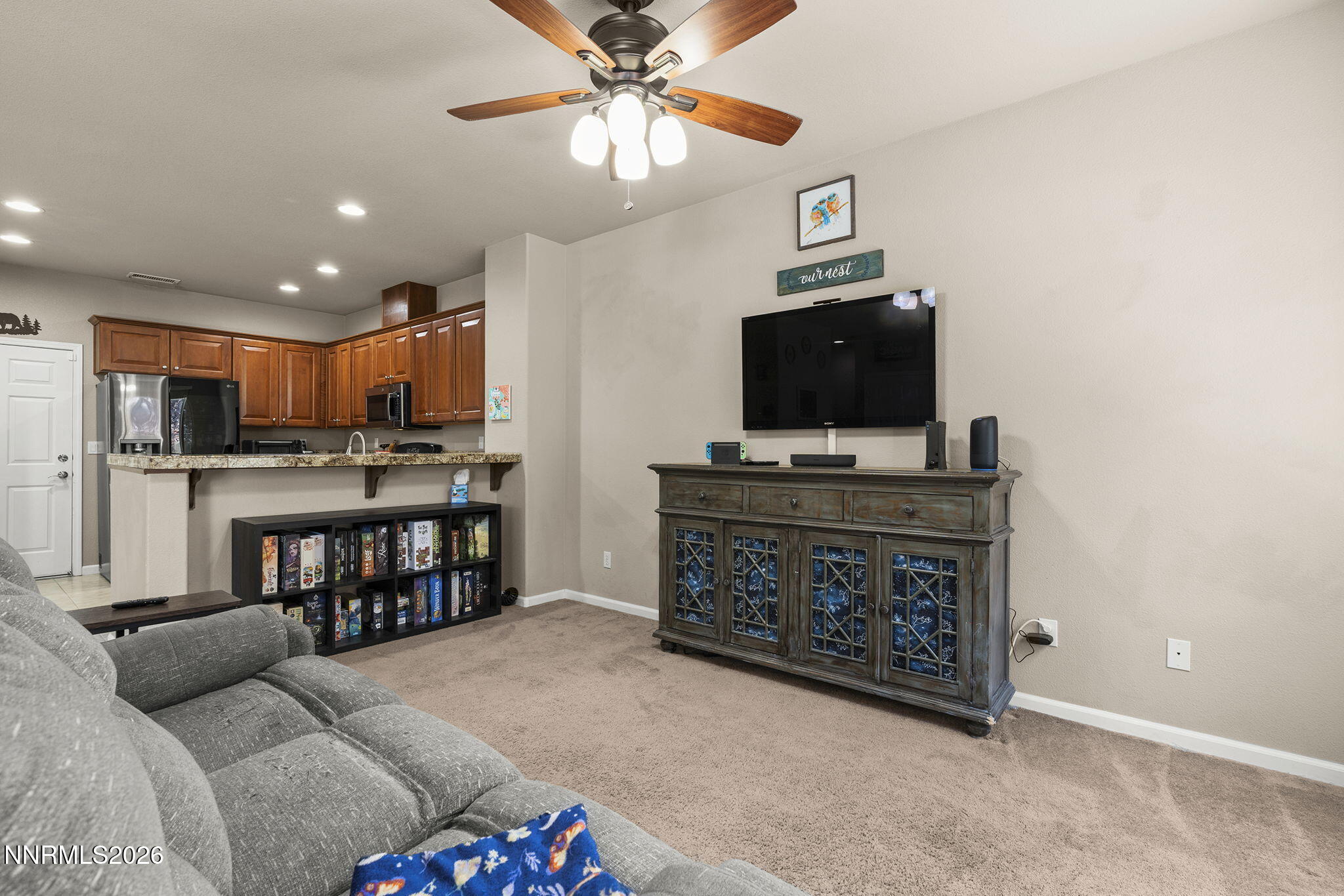 11041 Colton Drive Reno, NV 89521 - Photo 10 of 28 a living room with furniture and a flat screen tv