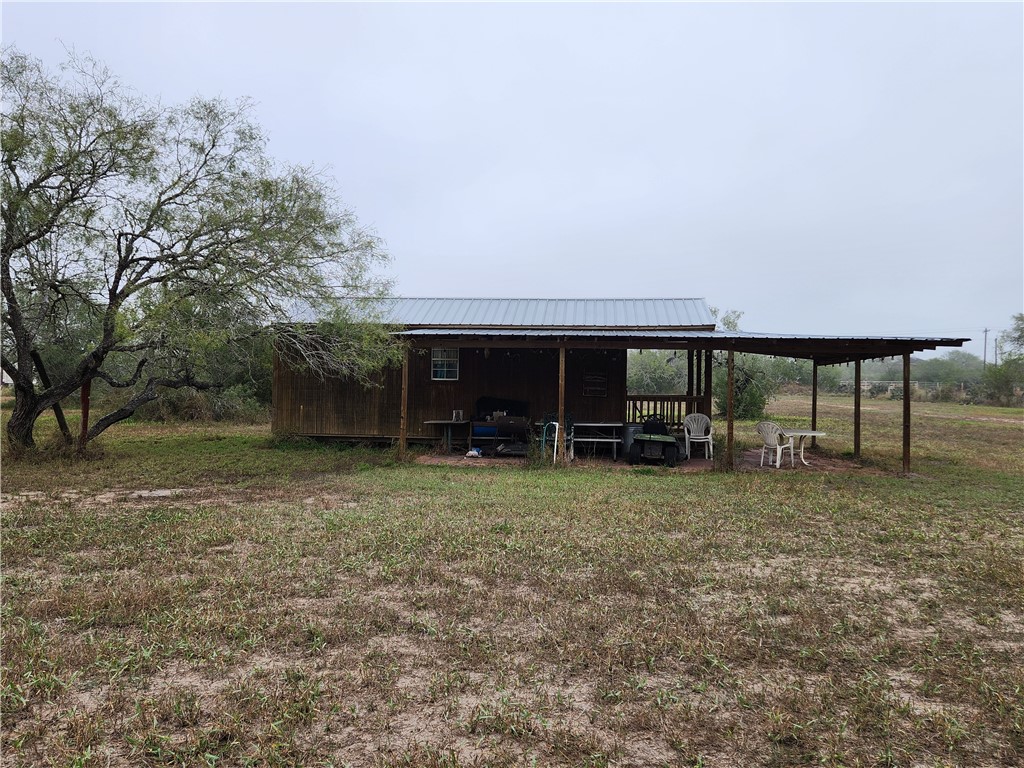 1888 County Road 440 Alice, TX 78332 - Photo 12 of 32 a backyard of a house with table and chairs