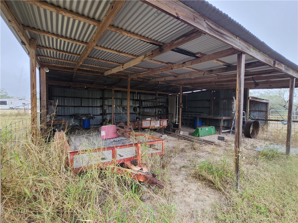 1888 County Road 440 Alice, TX 78332 - Photo 15 of 32 a view of a chairs and table in backyard