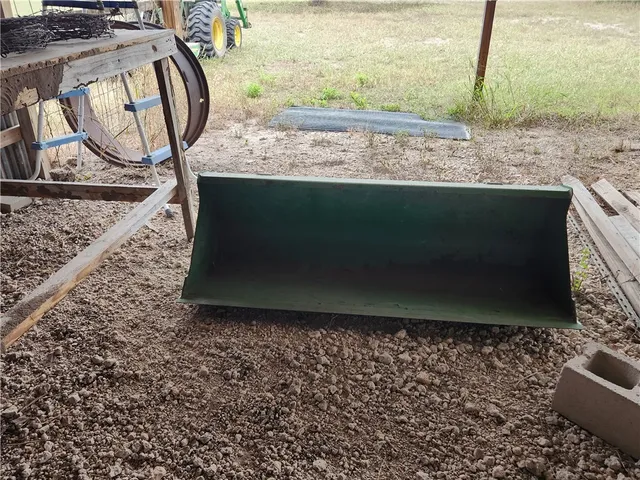 a view of a backyard with wooden fence