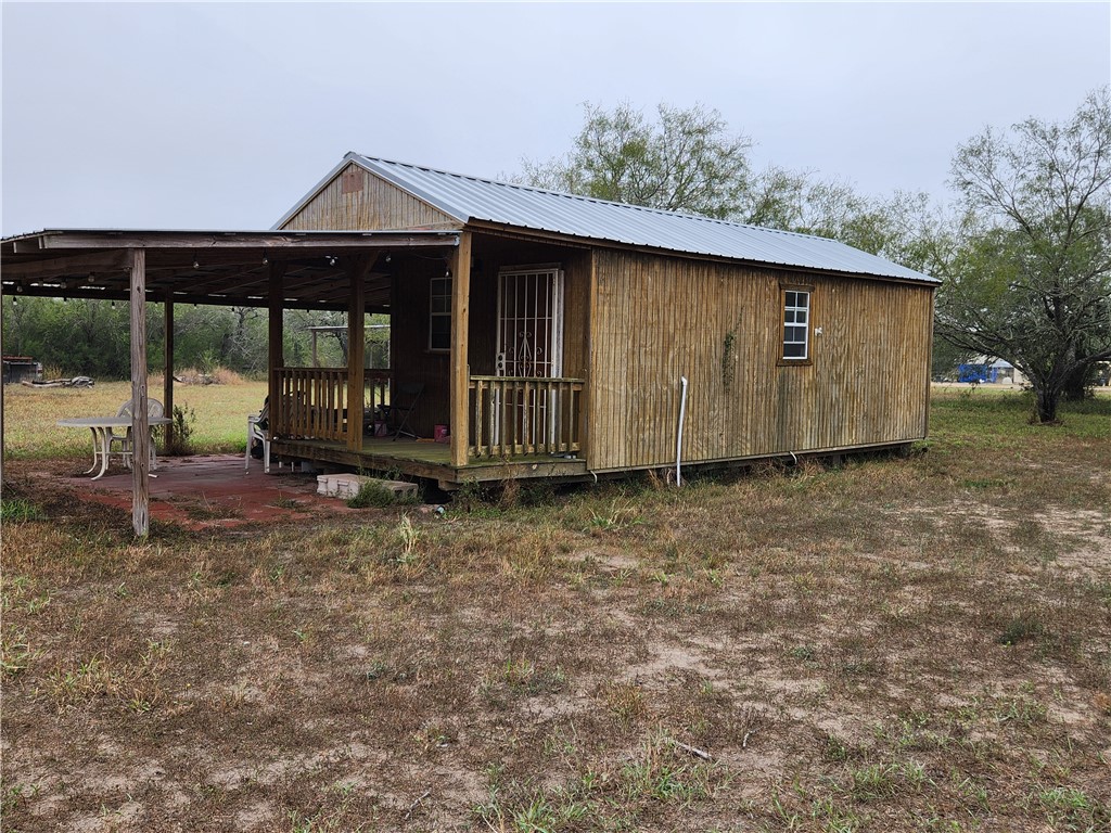 1888 County Road 440 Alice, TX 78332 - Photo 3 of 32 a front view of a house with a yard
