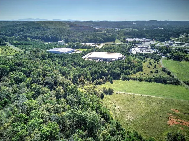 an aerial view of residential houses with outdoor and green space