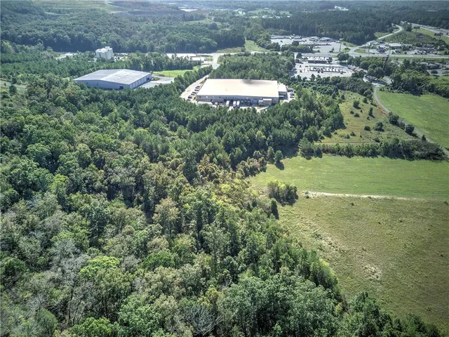 an aerial view of a house with yard and outdoor seating