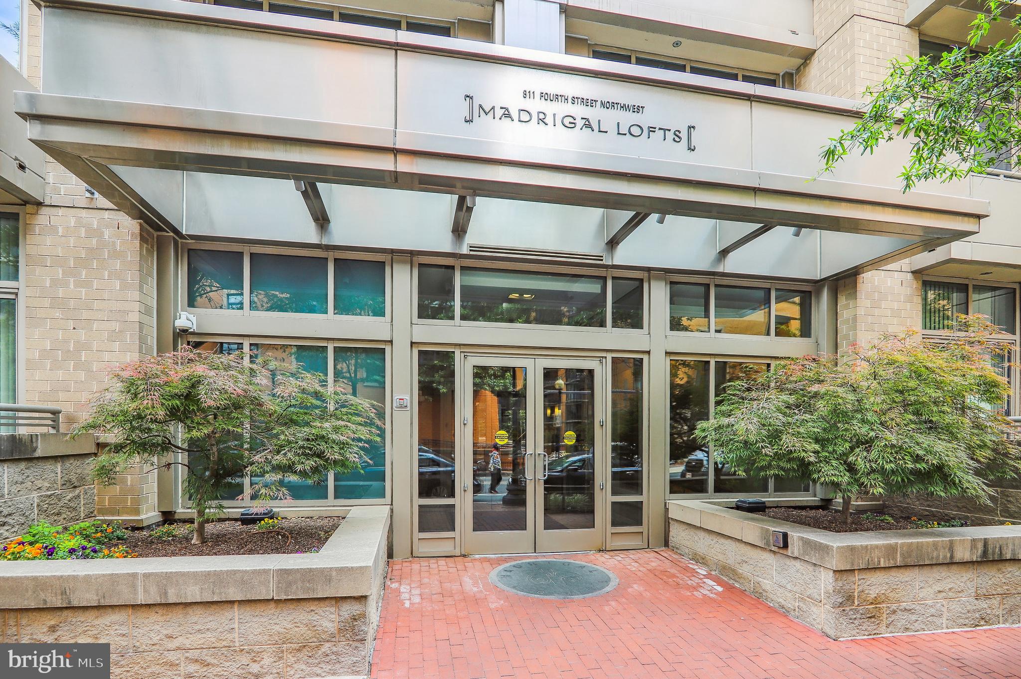 811 4th Street Northwest, Unit 1014 Washington, DC 20001 - Photo 1 of 21 a front view of a building with garden