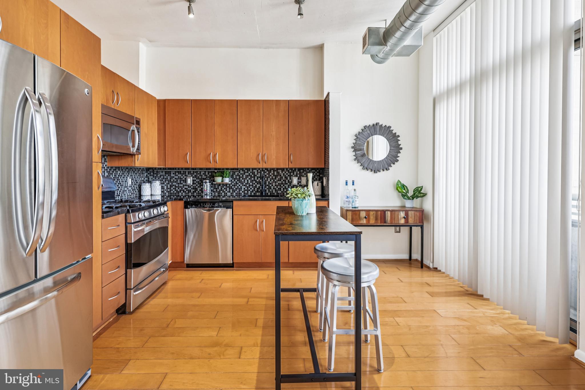 811 4th Street Northwest, Unit 1014 Washington, DC 20001 - Photo 12 of 21 a kitchen with a sink cabinets and stainless steel appliances