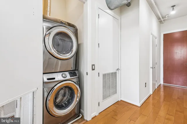 a view of a hallway with washer and dryer