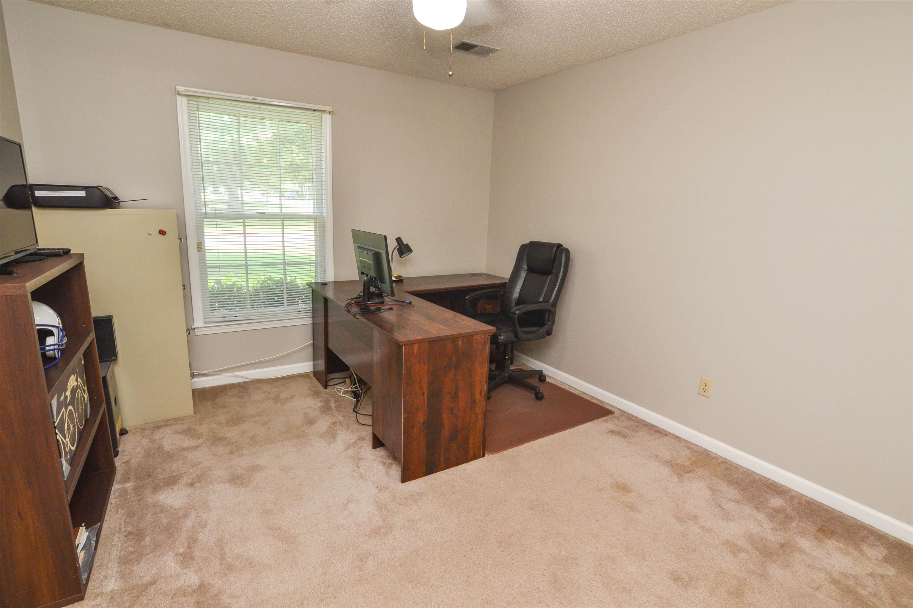 591 Rillbrook Drive Collierville, TN 38017 - Photo 15 of 25 a workspace with furniture and a window