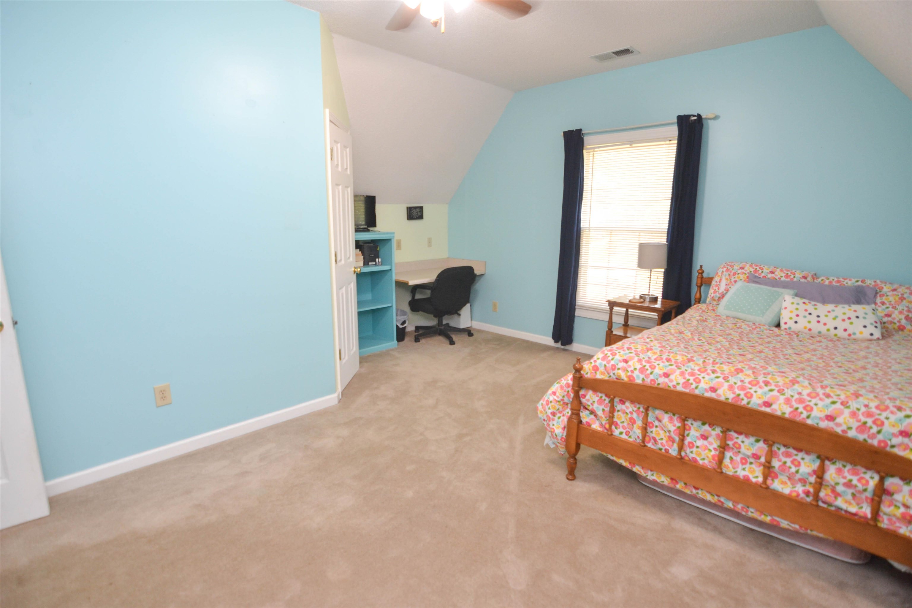 591 Rillbrook Drive Collierville, TN 38017 - Photo 18 of 25 a bedroom with a bed and window