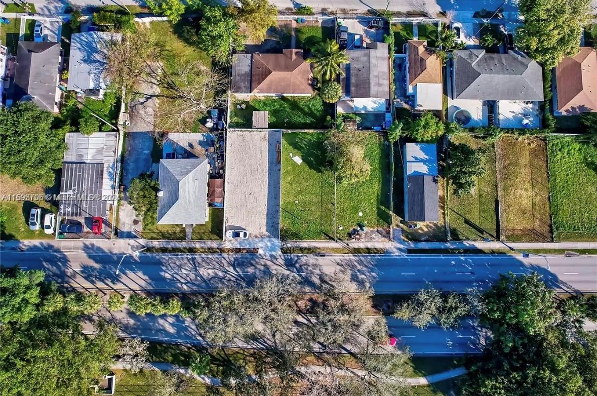 1861 Northwest 62nd Street Miami, FL 33147 - Photo 3 of 6 a view of a house with a street