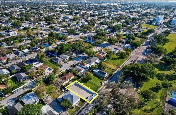 an aerial view of residential houses with outdoor space
