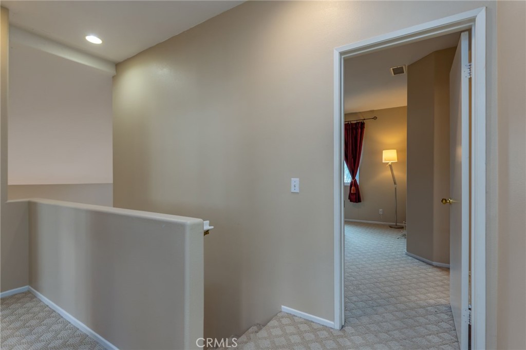 1654 Rush Haven Way Simi Valley, CA 93065 - Photo 17 of 32 a view of a hallway with wooden floor