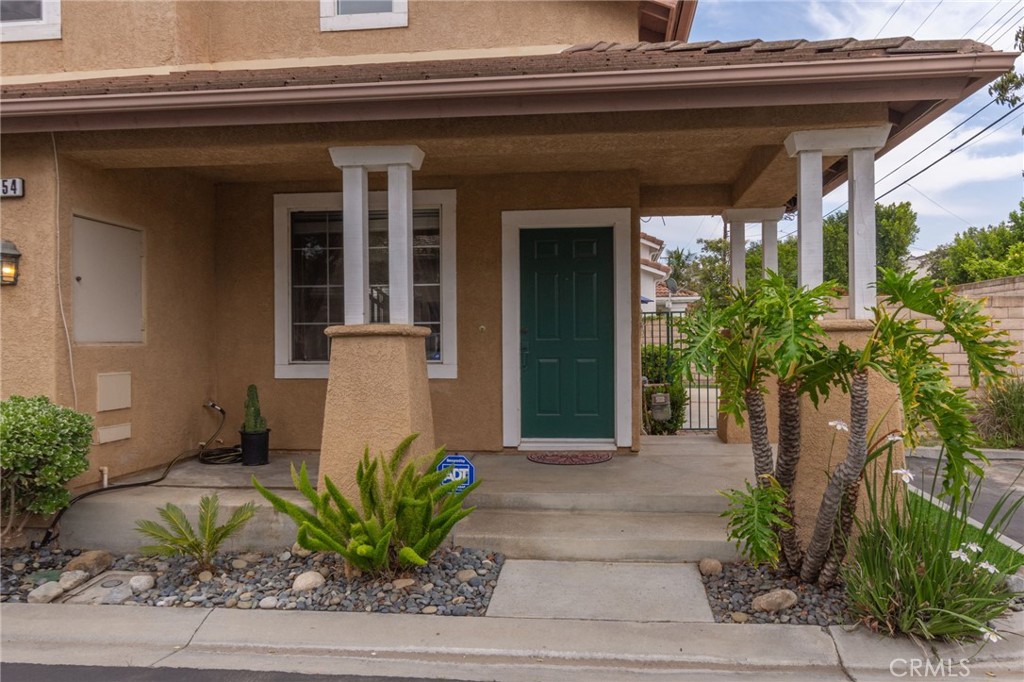 1654 Rush Haven Way Simi Valley, CA 93065 - Photo 3 of 32 a front view of a house with a yard