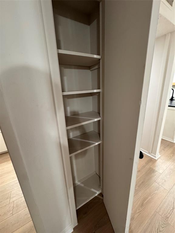 4859 Cedar Springs Road, Unit 150 Dallas, TX 75219 - Photo 27 of 31 a view of walk in closet with empty racks
