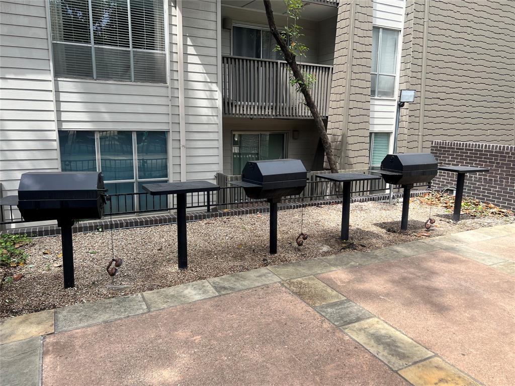 4859 Cedar Springs Road, Unit 150 Dallas, TX 75219 - Photo 5 of 31 a view of a house with backyard and sitting area