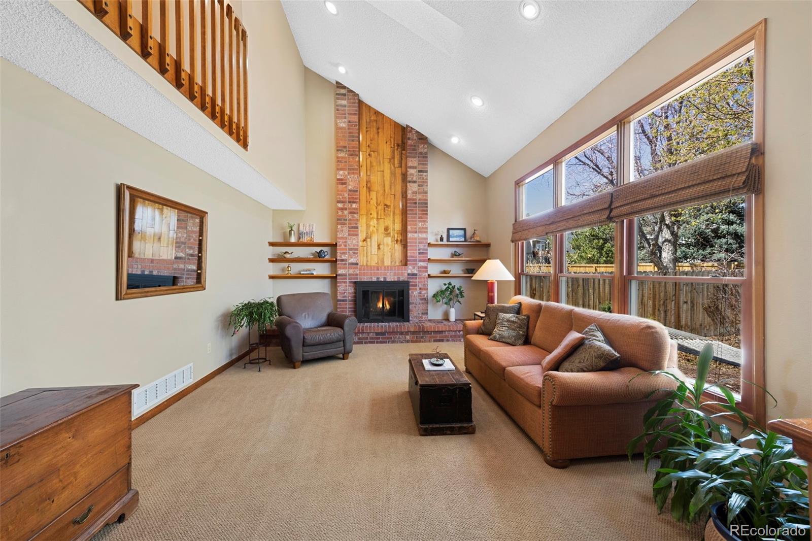 7975 Sweet Water Road Lone Tree, CO 80124 - Photo 16 of 43 a living room with furniture and a large window