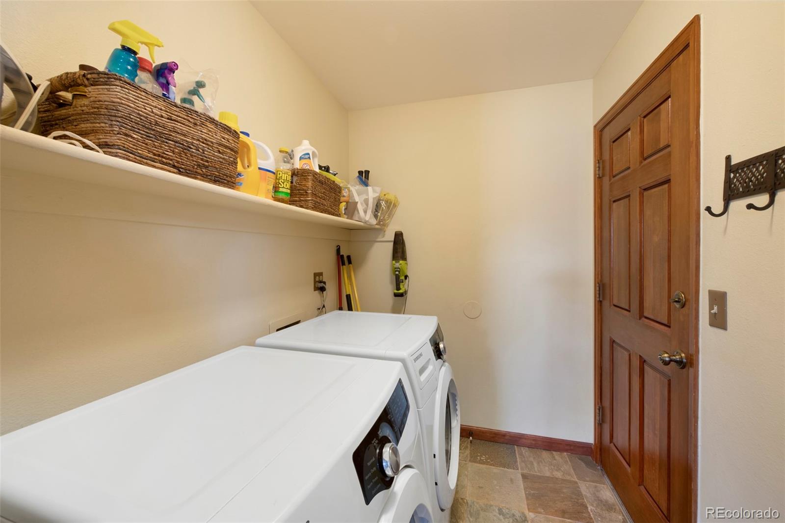 7975 Sweet Water Road Lone Tree, CO 80124 - Photo 19 of 43 a utility room with a sink dryer and washer