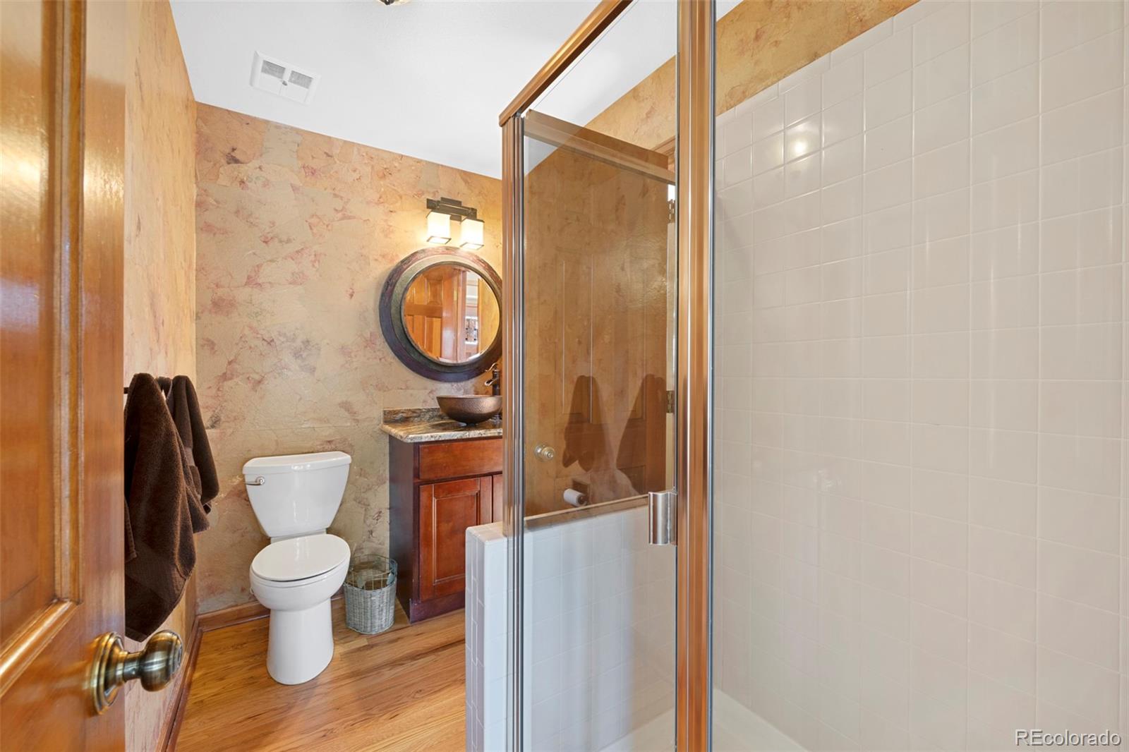 7975 Sweet Water Road Lone Tree, CO 80124 - Photo 23 of 43 a bathroom with a toilet and a sink