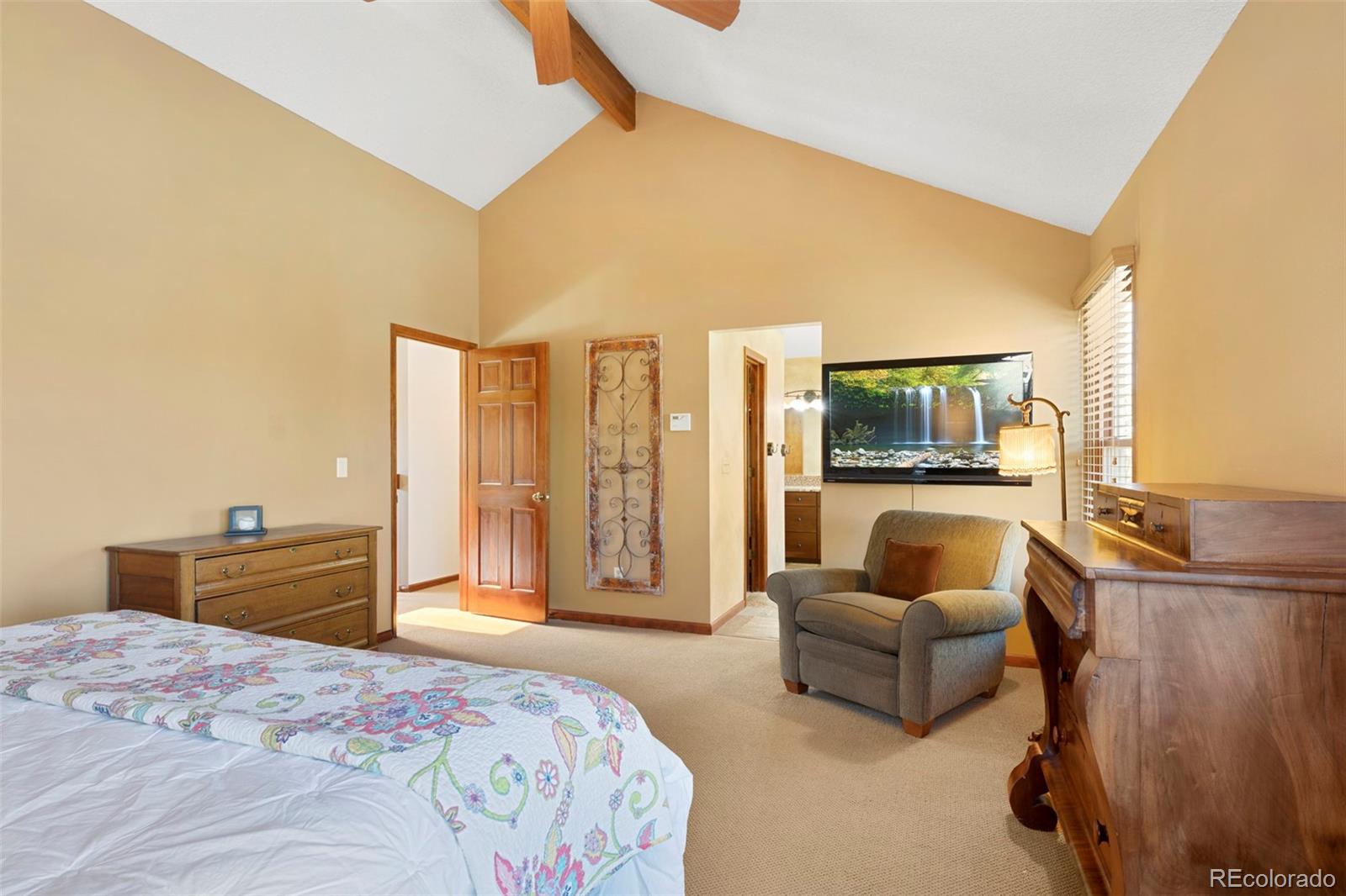 7975 Sweet Water Road Lone Tree, CO 80124 - Photo 26 of 43 a bedroom with furniture and a flat screen tv