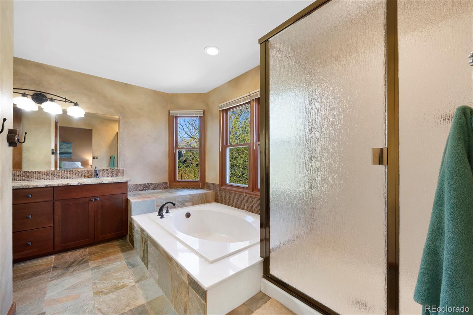 7975 Sweet Water Road Lone Tree, CO 80124 - Photo 27 of 43 a bathroom with a bathtub and a sink