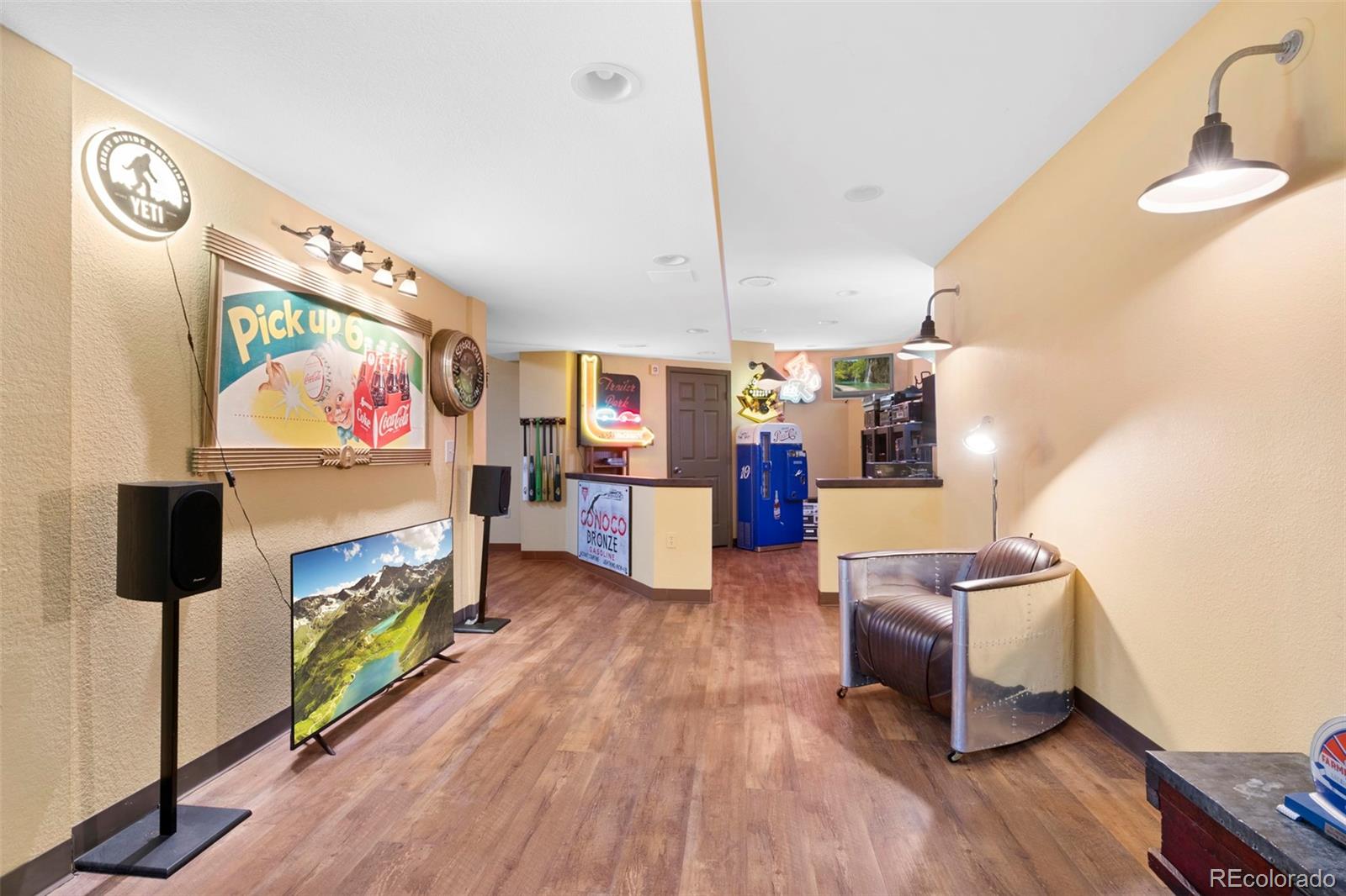7975 Sweet Water Road Lone Tree, CO 80124 - Photo 35 of 43 a living room with furniture and a flat screen tv