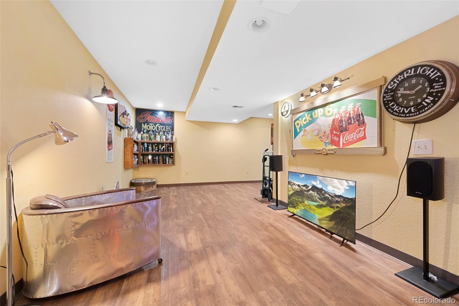 7975 Sweet Water Road Lone Tree, CO 80124 - Photo 36 of 43 wooden floor with a rug and a painting on the wall