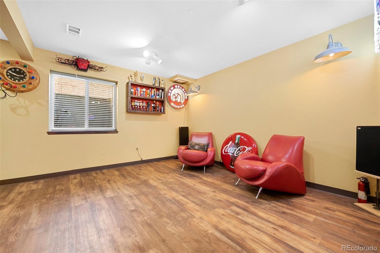 7975 Sweet Water Road Lone Tree, CO 80124 - Photo 37 of 43 a living room with furniture a flat screen tv and rug floor