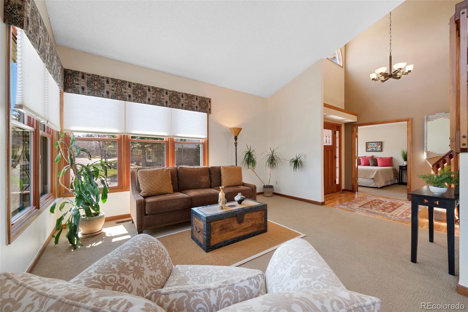 7975 Sweet Water Road Lone Tree, CO 80124 - Photo 9 of 43 a living room with furniture and a large window
