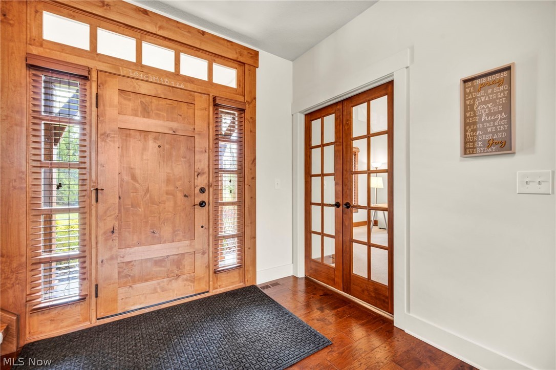 11295 Sutton Place Chardon, OH 44024 - Photo 6 of 50 Entryway with french doors, plenty of natural light, and dark wood-style flooring
