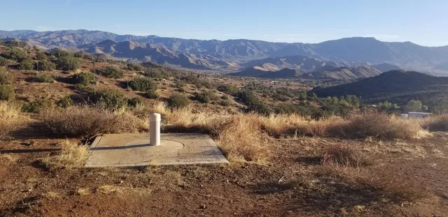 a view of a town with mountains in the background