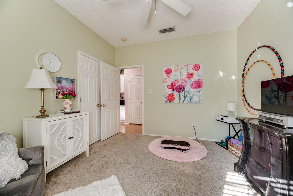 3205 Cape Cod Court Arlington, TX 76017 - Photo 25 of 30 a living room with furniture and a flat screen tv