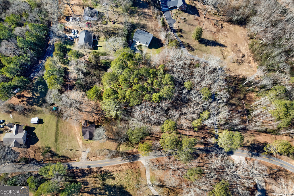 493 Morrison Camp Ground Road Northeast Rome, GA 30161 - Photo 3 of 6 a view of a fire pit in middle of the green field