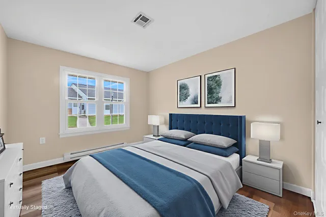 a bedroom with a large bed and a window