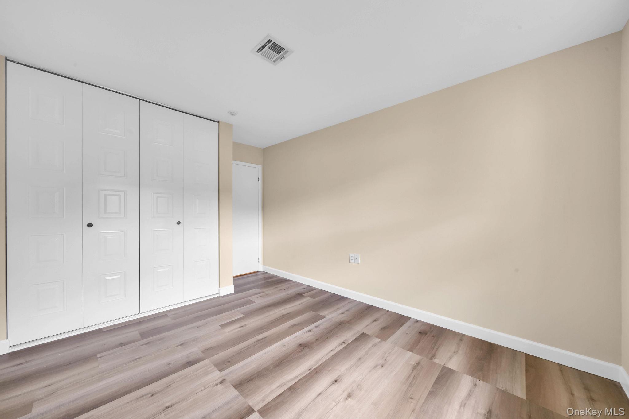 380 Woodbridge Drive, Unit D Ridge, NY 11961 - Photo 9 of 25 a view of an empty room