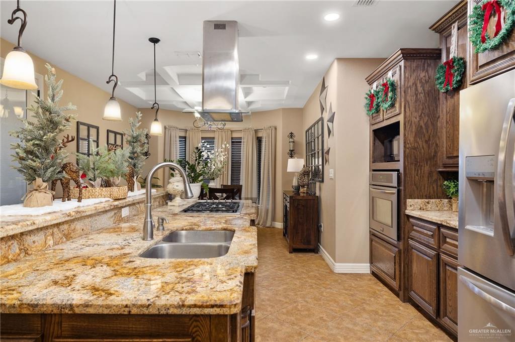 826 Coyote Drive Rio Grande City, TX 78582 - Photo 8 of 10 a kitchen with stainless steel appliances granite countertop a refrigerator and a sink