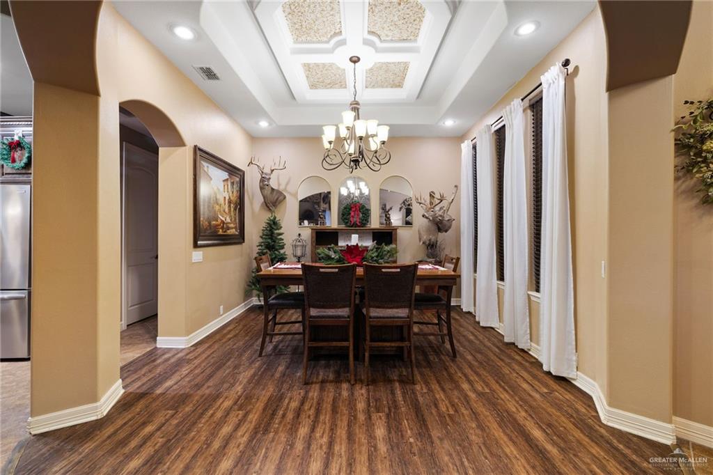 826 Coyote Drive Rio Grande City, TX 78582 - Photo 9 of 10 a view of a dining room with furniture and wooden floor