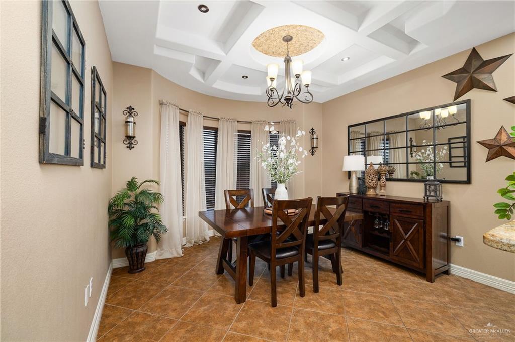 826 Coyote Drive Rio Grande City, TX 78582 - Photo 10 of 10 a view of a dining room with furniture and chandelier