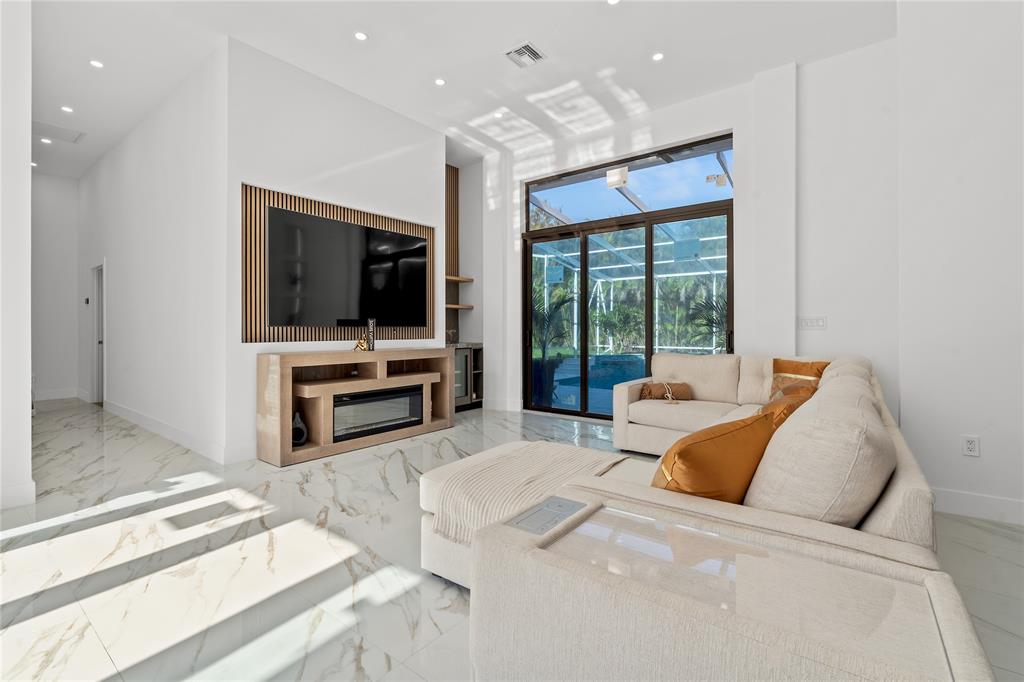7141 Mariana Court Boca Raton, FL 33433 - Photo 14 of 68 a living room with furniture and a flat screen tv