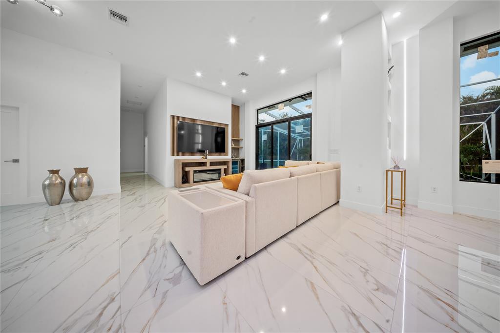 7141 Mariana Court Boca Raton, FL 33433 - Photo 17 of 68 a living room with furniture and a flat screen tv