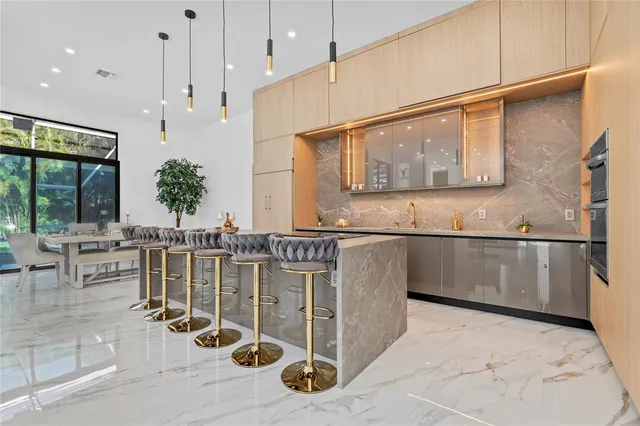a bathroom with a granite countertop sink a mirror and vanity