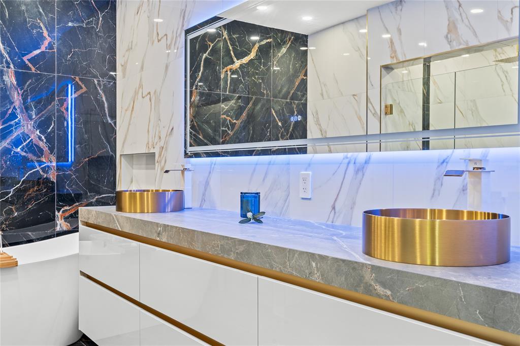 7141 Mariana Court Boca Raton, FL 33433 - Photo 34 of 68 a bathroom with a sink and a mirror