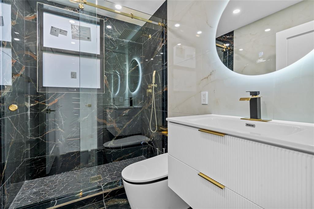 7141 Mariana Court Boca Raton, FL 33433 - Photo 35 of 68 a bathroom with a sink a toilet and shower